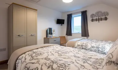 a bedroom with a bed and a window at Sherriff in Penrith