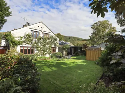 a house with a yard with a grassy yard at Croft in Grasmere