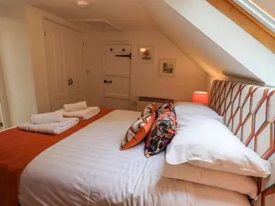 a bedroom with a bed with pillows on it at North Lodge in Grasmere