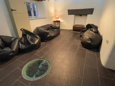 a room with two bags and a dog bed at Fairy Glen in Ambleside