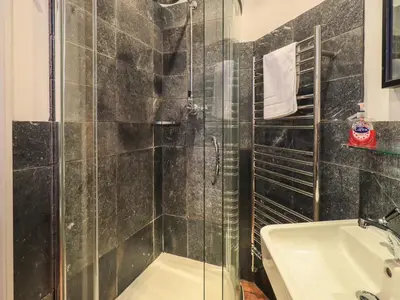 a bathroom with a shower and a sink at Fairy Glen in Ambleside