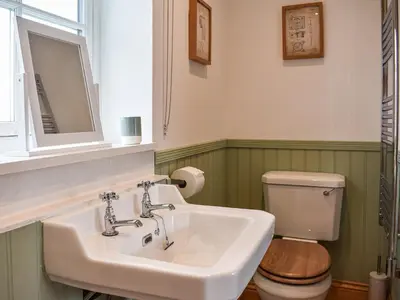 a bathroom with a sink and a toilet at The Old Workshop in Keswick