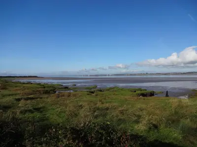 a view of the ocean from a field at Bowness Bed & Breakfast Double Room, Bowness-on-Solway in Bowness-on-Solway