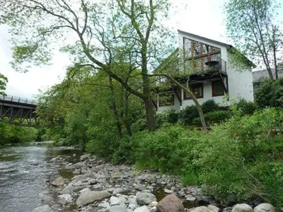 a house on a hill next to a river at Keswick Bridge 22, within walking distance of Keswick town centre, strictly no pets in Keswick