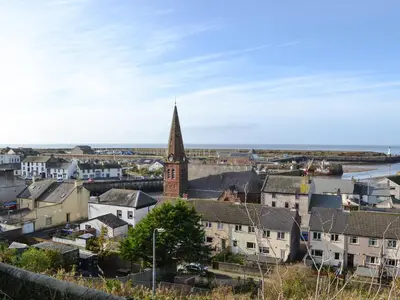 a view of a city with a clock tower at Harbour Watch in Maryport