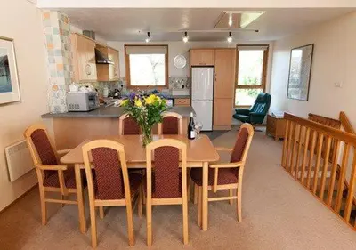 a kitchen and dining room with a table and chairs at Keswick Bridge 10, within walking distance of Keswick town centre, strictly no pets in Keswick