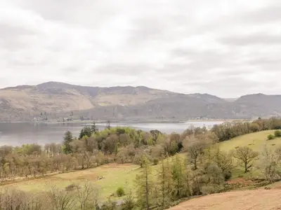 a view of a lake with mountains in the background at Apartment 1 Latrigg in Keswick