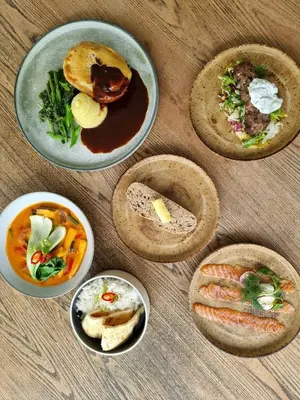 a group of bowls of food on a table at The Old Mill Inn in Dearham