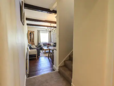 a hallway with a living room and a dining room at St Giles in Ambleside