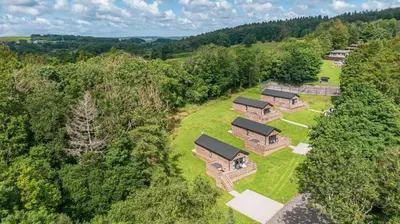 an overhead view of a house in the trees at Squirrel Lodge 43 with Hot Tub in Newton Stewart