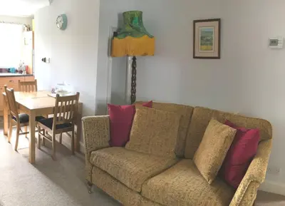 a living room with a couch and a table at Abbey Green, New Abbey, Dumfries and Galloway in Dumfries
