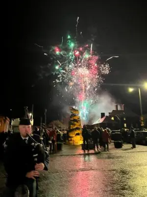 a crowd of people watching fireworks at night at Cosy country cottage in rural location in Moffat