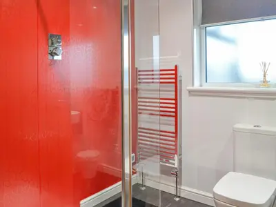 a bathroom with a shower and a toilet at Jura in Mainsriddle