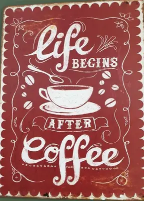 a sign that says life begins after coffee with a cup at Pinfold Cottage on the edge of lake district in Bothel