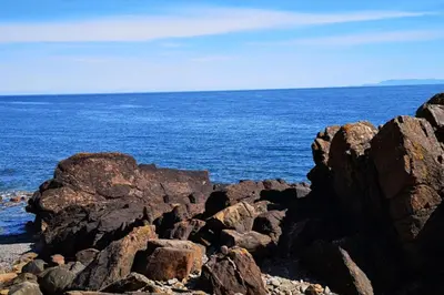 a group of rocks on the shore of the ocean at Caravan - Sleeps 4 - Pet friendly - Parking in Newton Stewart