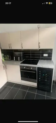 a kitchen with a sink and a stove top oven at Elegant bungalow in Newmilns, East Ayrshire in Newmilns