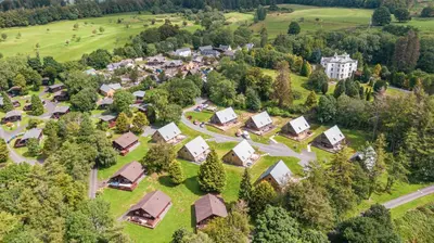 an aerial view of a small village with houses at Birch Lodge 14 with Hot Tub in Newton Stewart