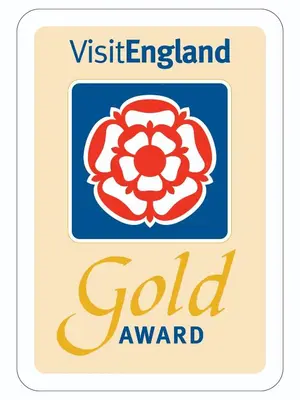 a logo for the vietnamese gold award at Lilac Cottage in Keswick