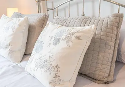 a group of pillows sitting on a bed at Felltops in Keswick