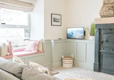 a living room with a couch and a window at Brandelhowe in Keswick