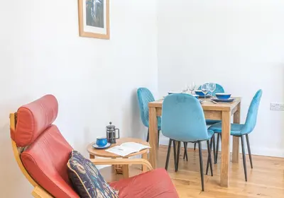 a dining room with a table and chairs at Riverside View in Keswick