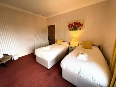 a hotel room with two beds in a room at Beautiful Period Property in Central Location - Pass the Keys in Maxwelltown