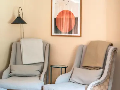 two chairs and a lamp in a room at Cleugh Foot in Longtown