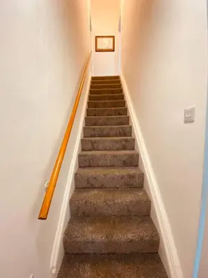 a staircase in a house with a stair case at Luxury 2 bed apt 4 mins from M6 J44 pet friendly, in Carlisle