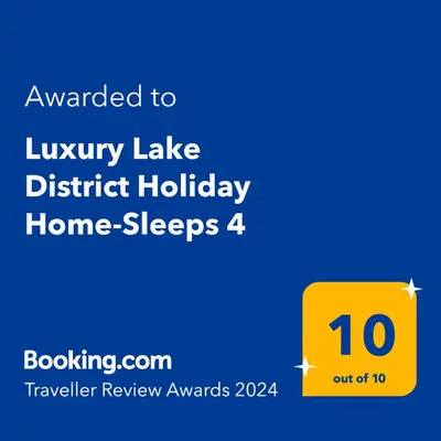 a yellow sign that reads luxury lake district holiday home sleeps at Luxury Lake District Holiday Lodge-Sleeps 4 in Cockermouth