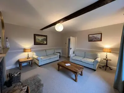 a living room with two couches and a coffee table at House - Sleeps 10 Pet friendly & Parking in Wigton