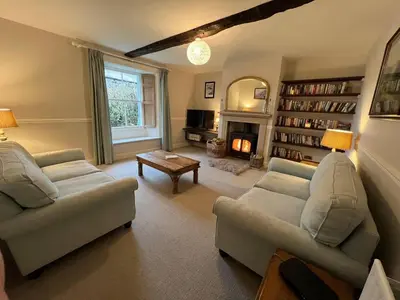 a living room with two couches and a fireplace at House - Sleeps 10 Pet friendly & Parking in Wigton