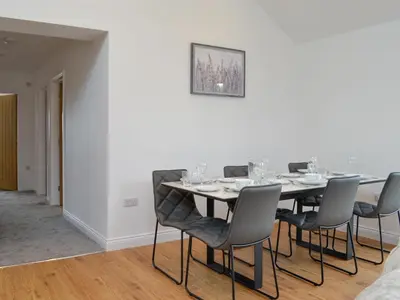a dining room with a table and chairs at Old Byre Cottage - Uk43377 in Kirklinton