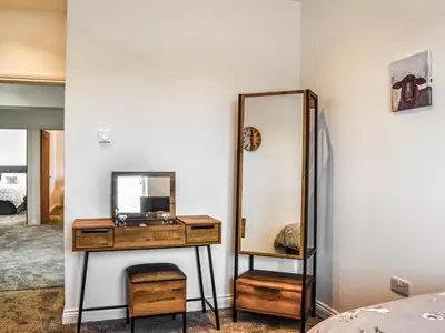 a dressing room with a mirror and a dresser at Fell View Cottage - Uk43378 in Kirklinton