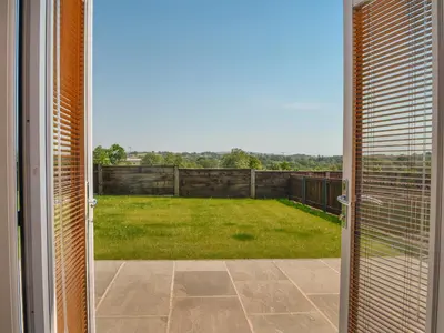 an open door with a view of a yard at Fell View Cottage - Uk43378 in Kirklinton