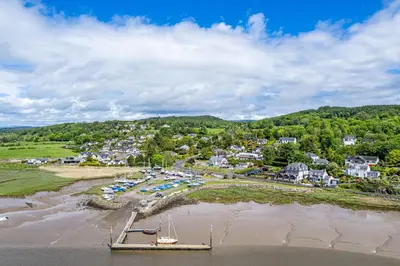 an aerial view of a beach with a boat in the sand at Bells View in Kippford