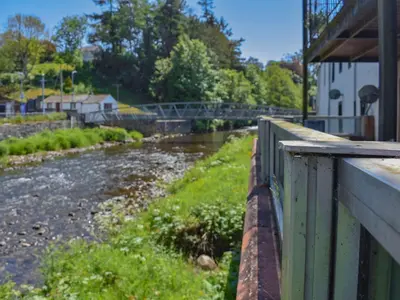 a view of a river from a bridge at Hatters Croft in Cockermouth