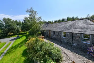 an overhead view of a stone house with a garden at Popsal in Kirkcowan