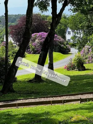 a sign that reads kates hines kerkhof in a park at Kates Home Lagganhouse Woodland Way 19 in Ballantrae