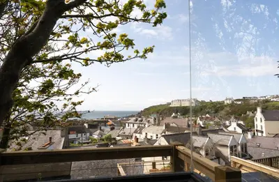 a view of the city from the roof of a house at The Portpatrick Pad - A cosy 3 bed cottage, w. sea views & garden office in Portpatrick