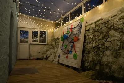 a room with a door with lights on it at The Portpatrick Pad - A cosy 3 bed cottage, w. sea views & garden office in Portpatrick