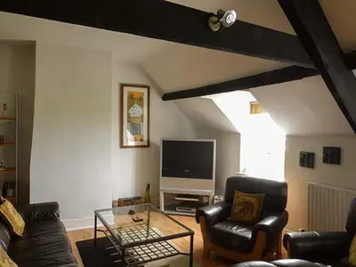 a living room with a couch and a tv at Gulls Hatch in Maryport