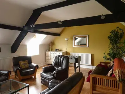a living room with a couch and chairs and a table at Gulls Hatch in Maryport