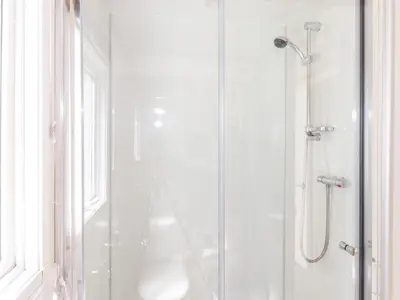 a bathroom with a shower with a glass door at Whiteside in Cockermouth