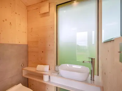 a bathroom with a sink and a window at The Curve At Caerlaverock Estate in Glencaple
