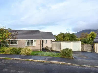 a house with a driveway and a garage at Brow Riding in Keswick