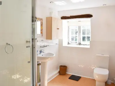 a bathroom with a sink and a toilet at Rushgill House in Sebergham